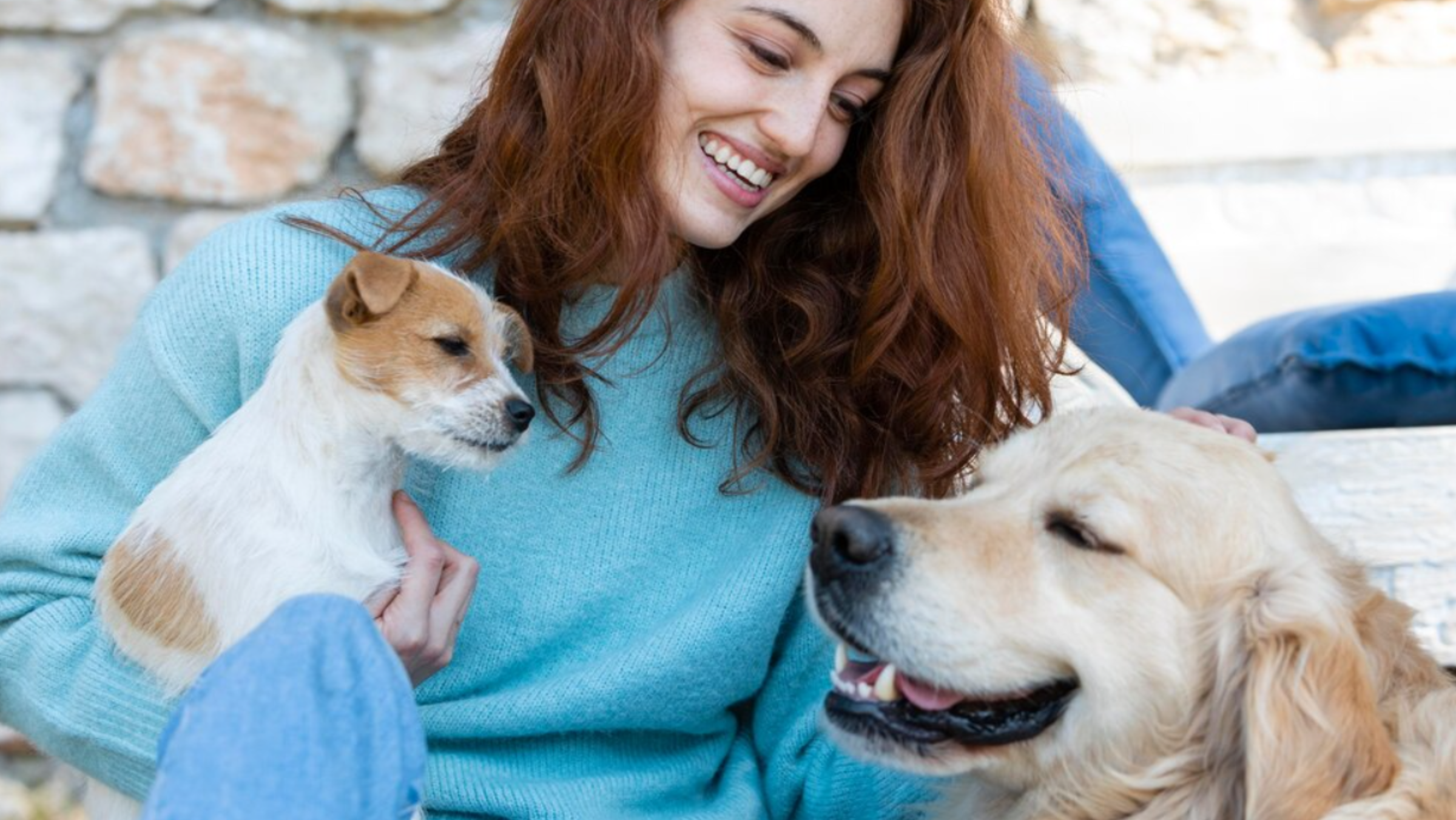Woman Laughing with her Two Dogs